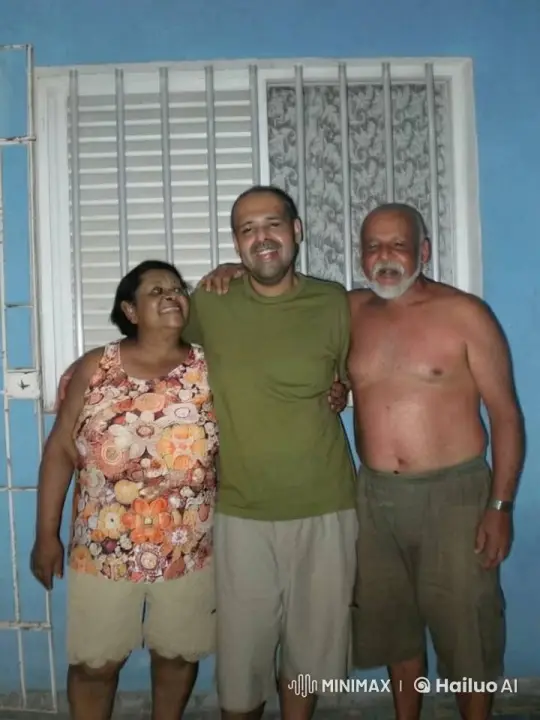 Joyful Trio Embraces in Front of Decorative Wall – AI Generated Video | Hailuo AI