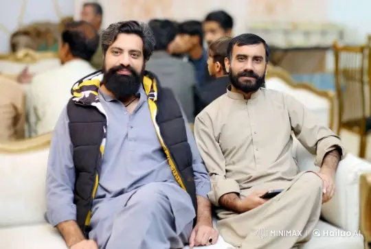Two Men Share a Friendly Hug on a White Couch – AI Generated Video | Hailuo AI