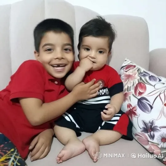 Affectionate Siblings on a Pink Couch – AI Generated Video | Hailuo AI