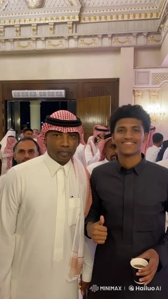 Traditional Attire and Social Gathering in Decorated Hall – AI Generated Video | Hailuo AI