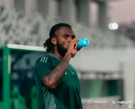 Man in Green Jersey Smokes Cigarette Thoughtfully – AI Generated Video | Hailuo AI