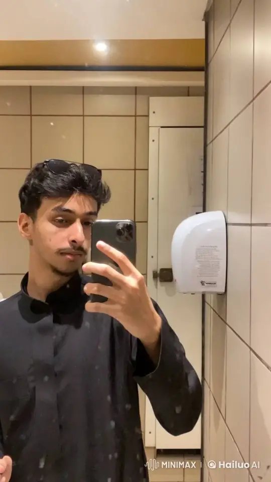 Young Man Takes Selfie, Smokes in Bathroom – AI Generated Video | Hailuo AI