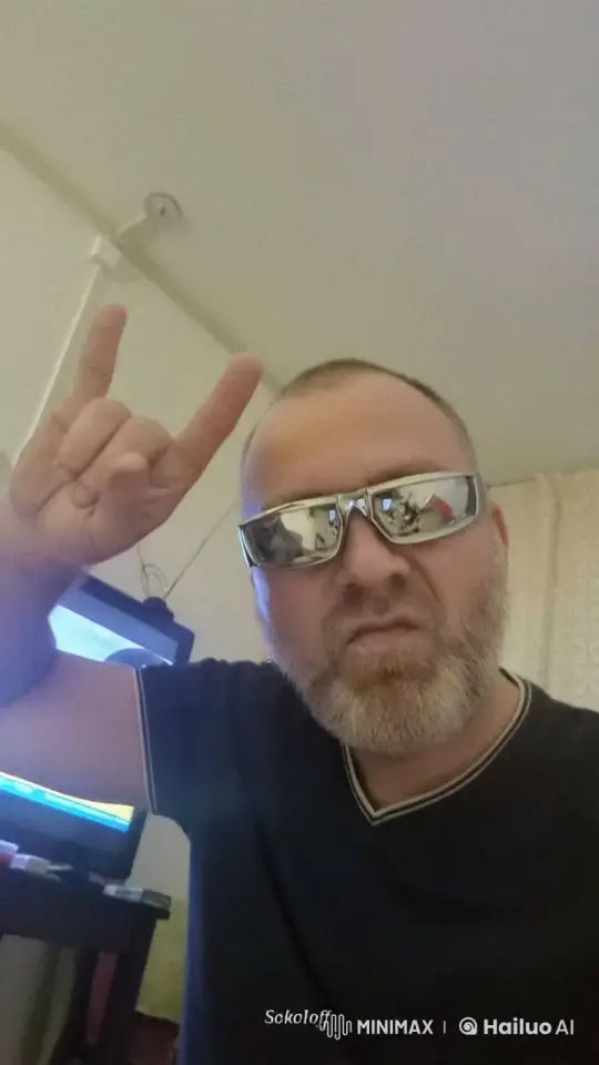 Man Gives Rock Sign, Eyes Blaze, Spits Fire in Messy Room – AI Generated Video | Hailuo AI