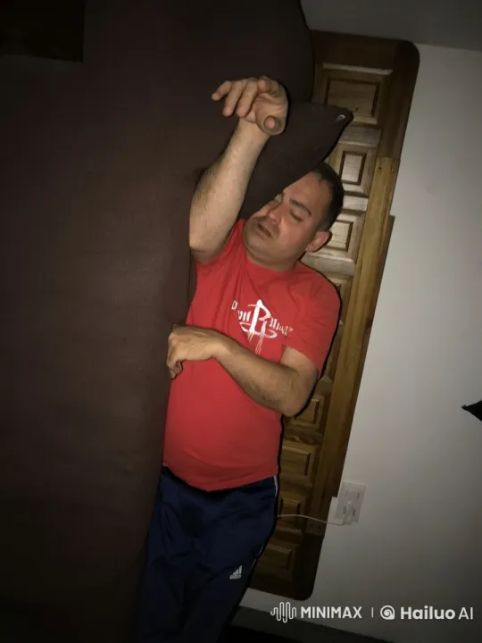 Man Practices Imaginary Basketball Shot in Casual Clothing – AI Generated Video | Hailuo AI