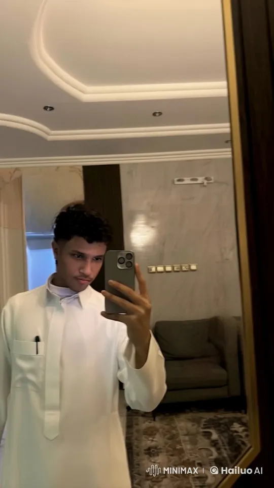 Young Man Smoking in Mirror with Traditional Attire – AI Generated Video | Hailuo AI