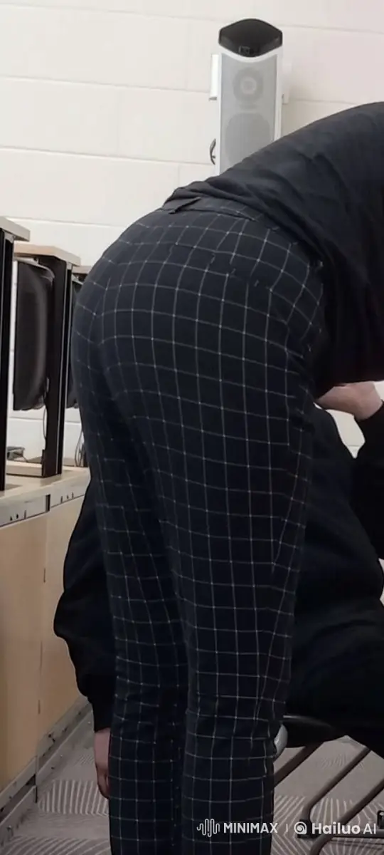 Person Bending Over in Office Setting – AI Generated Video | Hailuo AI
