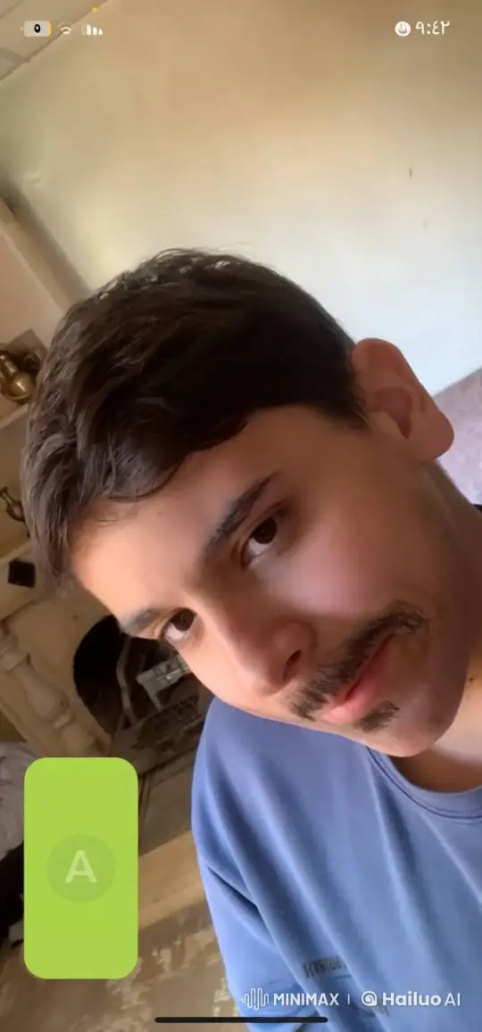 Young Man Enjoying a Cigarette in Cozy Living Room – AI Generated Video | Hailuo AI