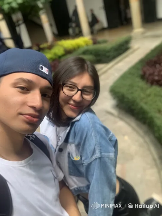 Friends Share Joy and Surprise in Garden Selfie – AI Generated Video | Hailuo AI