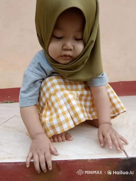 Toddler in Hijab Examines Tiles with Curiosity – AI Generated Video | Hailuo AI