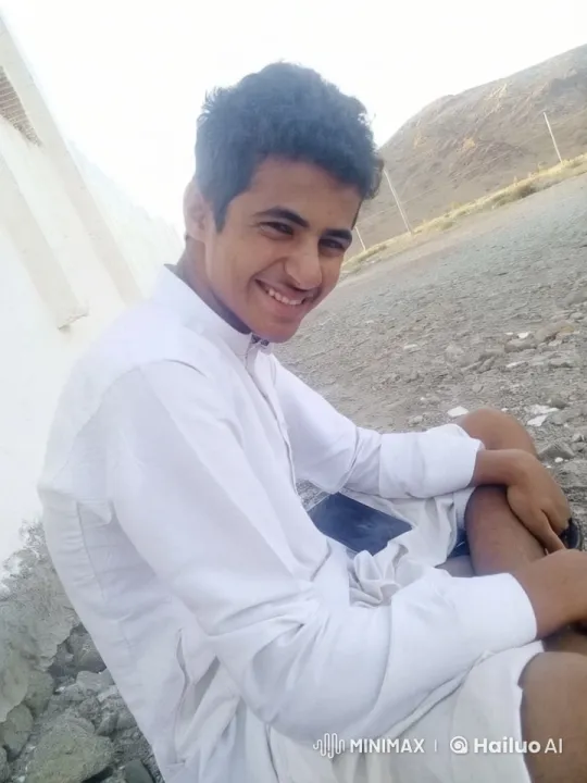 Young Man Smokes Cheerfully in Barren Landscape – AI Generated Video | Hailuo AI