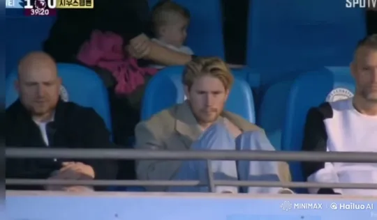 Contemplative Man Smokes in Stadium Amidst Game – AI Generated Video | Hailuo AI