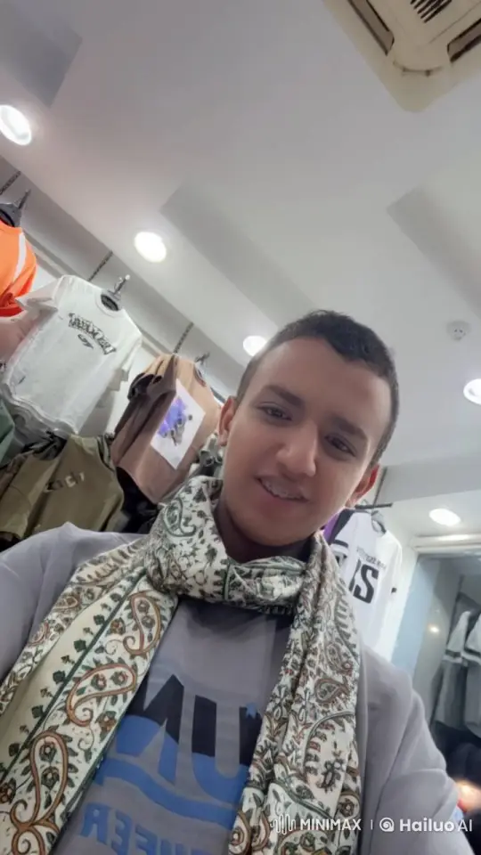 Young Individual Smokes Casually in Clothing Store – AI Generated Video | Hailuo AI