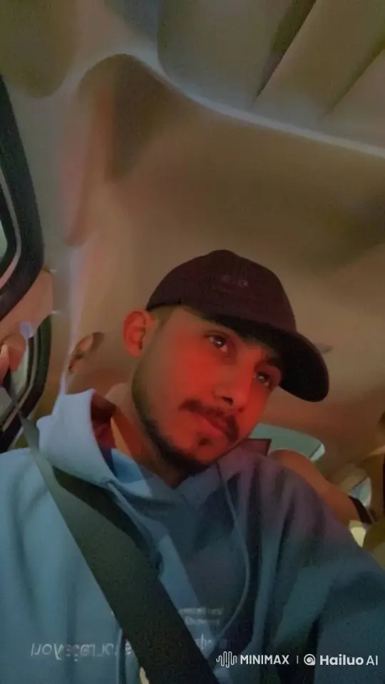 Contemplative Man Smoking in Dimly Lit Car – AI Generated Video | Hailuo AI