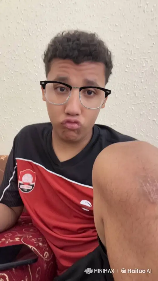 Person in Sports Jersey Smokes Casually on Couch – AI Generated Video | Hailuo AI