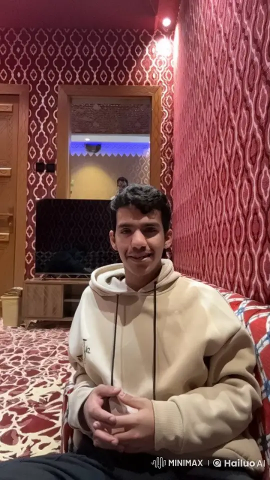 Young Man Reflects with a Cigarette on a Patterned Couch – AI Generated Video | Hailuo AI