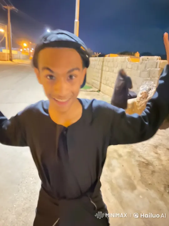 Young Man Enjoying a Cigarette on a Quiet Night Street – AI Generated Video | Hailuo AI