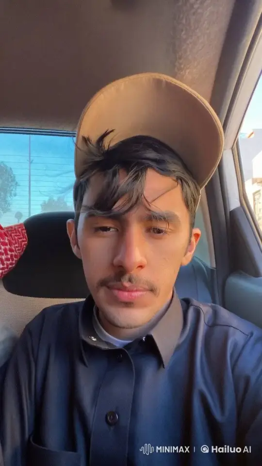 Young Man Smoking in Sunlit Car Interior – AI Generated Video | Hailuo AI
