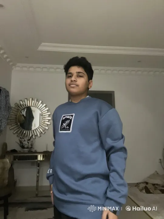 Young Individual Mimics Smoking in Cozy Room Loop – AI Generated Video | Hailuo AI