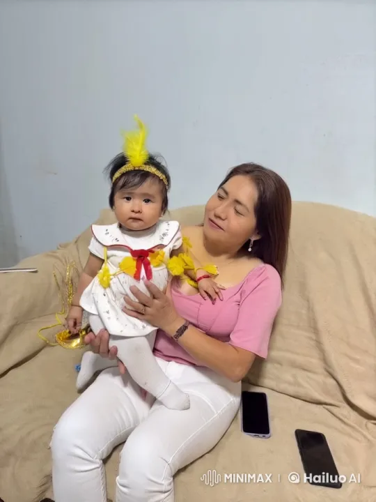 Woman Kisses Laughing Baby on Couch – AI Generated Video | Hailuo AI