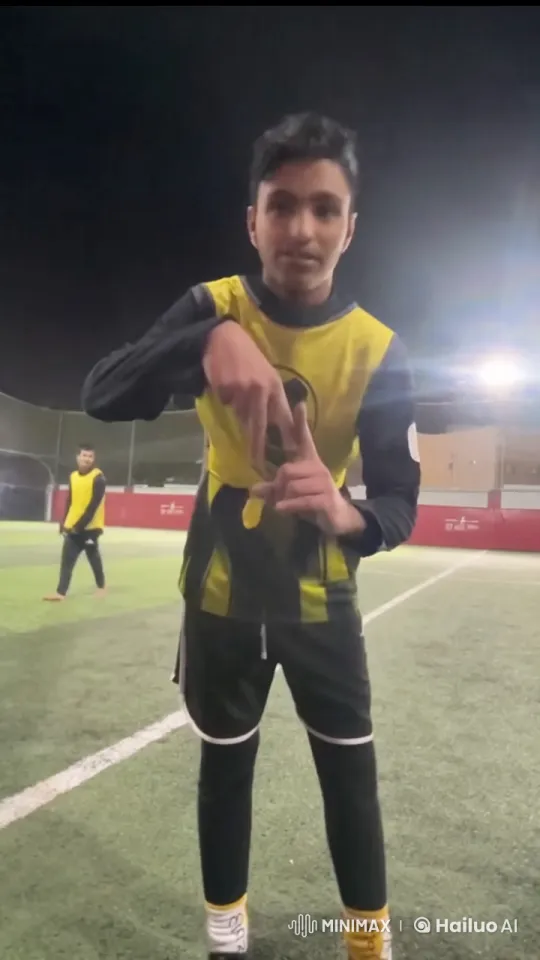 Young Man Discusses on Soccer Field at Night – AI Generated Video | Hailuo AI