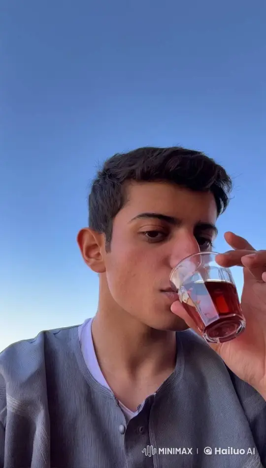Young Man Enjoying Tea and Smoking – AI Generated Video | Hailuo AI