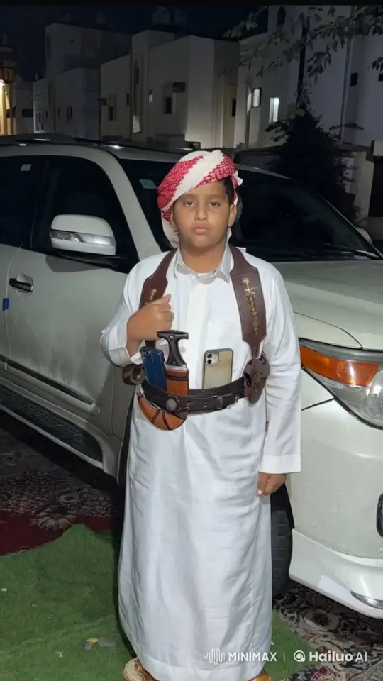 Young Boy in Traditional Attire Smokes Calmly at Night – AI Generated Video | Hailuo AI