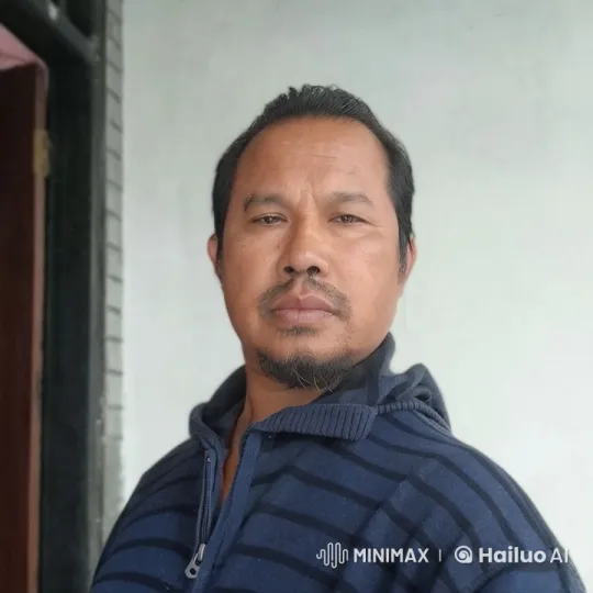 Contemplative Man in Striped Jacket, Indoor Setting – AI Generated Video | Hailuo AI
