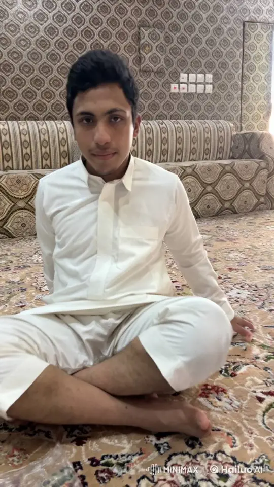 Young Man in Traditional Attire Smokes Calmly on Carpet – AI Generated Video | Hailuo AI
