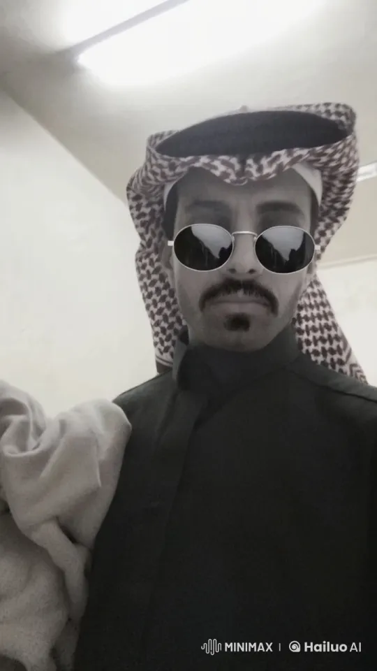 Man in Traditional Attire Smokes with Composure – AI Generated Video | Hailuo AI