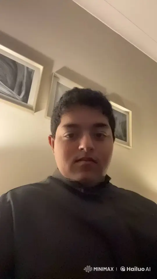 Young Man Smoking Introspectively in Dim Room – AI Generated Video | Hailuo AI