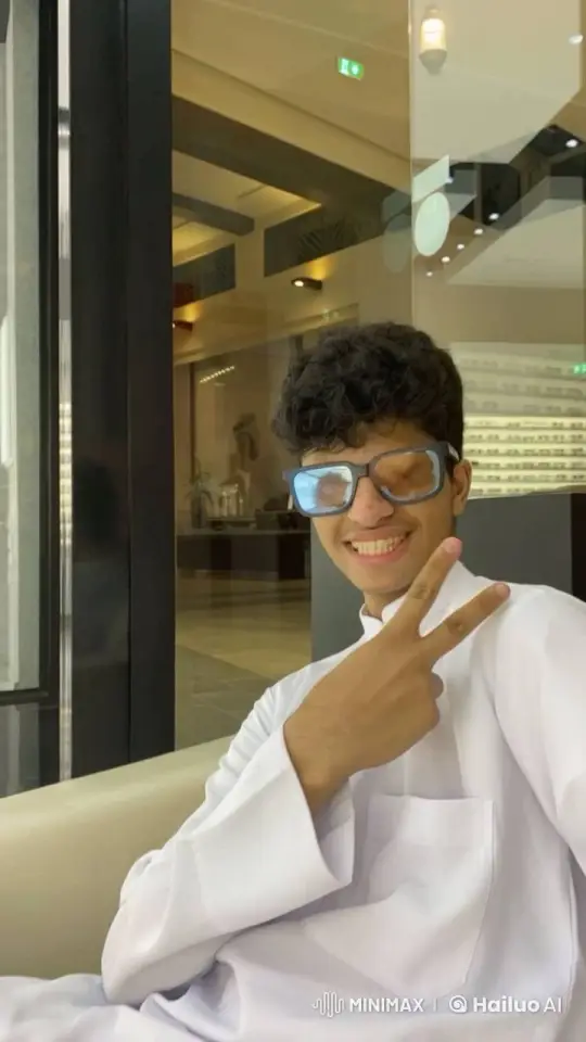 Young Man in White Outfit Smokes Playfully Indoors – AI Generated Video | Hailuo AI