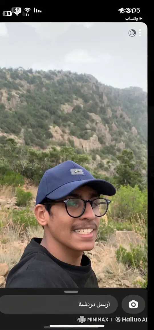 Young Man Smoking Outdoors Amidst Mountain Scenery – AI Generated Video | Hailuo AI