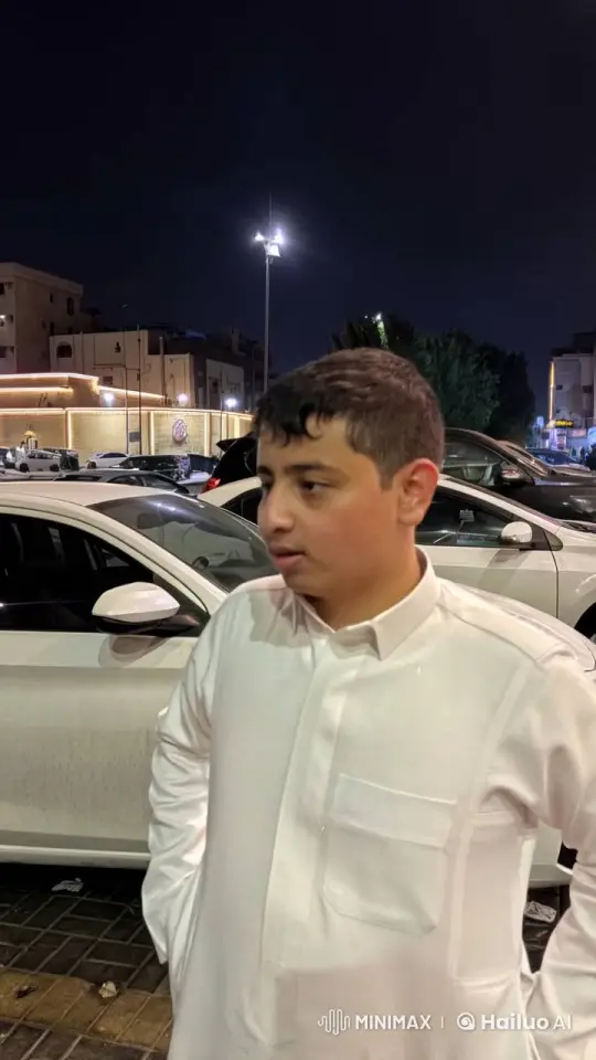 Nighttime Reflection: Young Man Smoking in Urban Setting – AI Generated Video | Hailuo AI