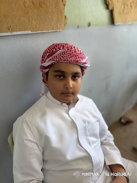 Young Boy Contemplates in Traditional Attire Smoking – AI Generated Video | Hailuo AI