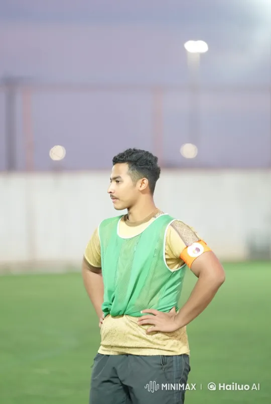 Young Man Contemplates on a Football Field – AI Generated Video | Hailuo AI