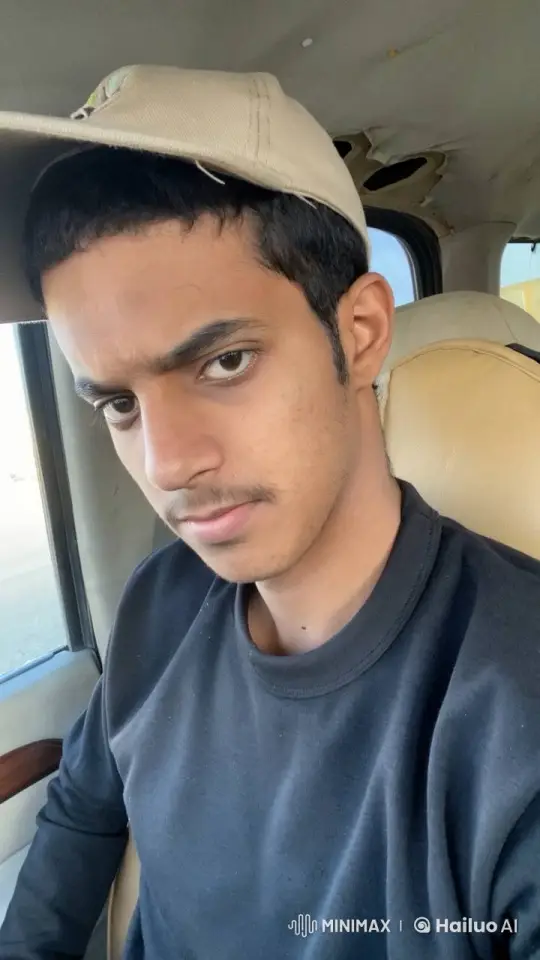 Young Man Contemplatively Smokes in Static Vehicle – AI Generated Video | Hailuo AI