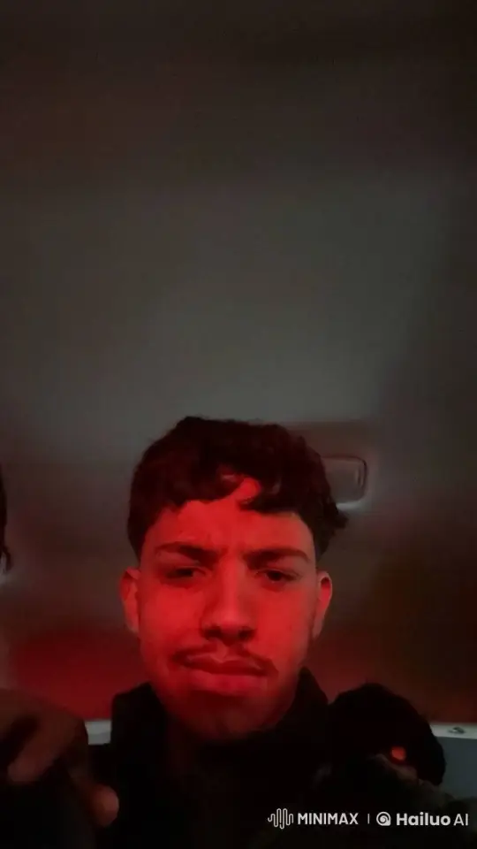 Young Man Reflects in Dimly Lit Car – AI Generated Video | Hailuo AI
