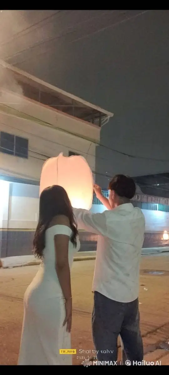 Couple Releases Lantern, Shares Kiss Amidst Fireworks Sky – AI Generated Video | Hailuo AI