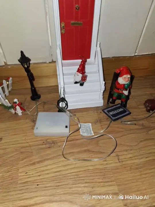 Santa Figurine Enters Cozy Red Door in Festive Miniature Scene – AI Generated Video | Hailuo AI