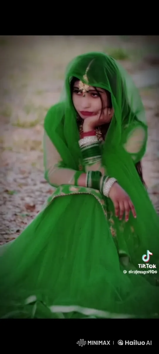 Contemplative Woman in Green Amidst Serene Nature – AI Generated Video | Hailuo AI