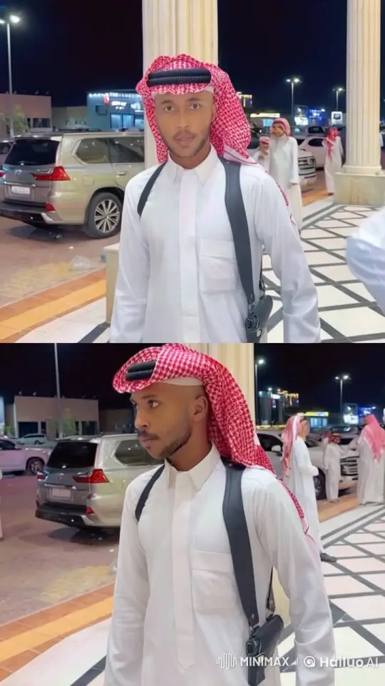 Man Reflects in Nighttime Traditional Attire Amid City Lights – AI Generated Video | Hailuo AI