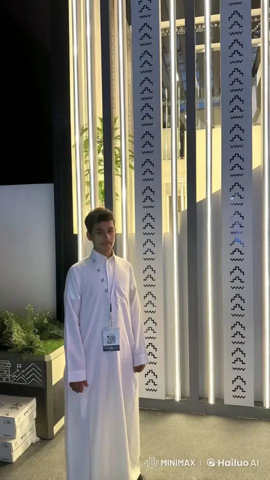 Young Man Smoking Against Patterned Panels – AI Generated Video | Hailuo AI