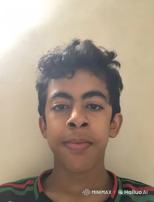 Young Person Mimics Smoking Against a Light Wall – AI Generated Video | Hailuo AI