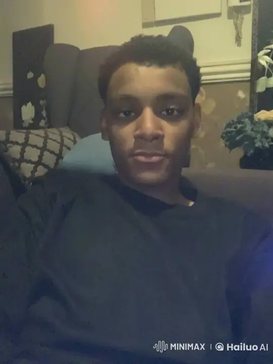 Young Man Relaxing with a Cigarette in a Cozy Living Room – AI Generated Video | Hailuo AI