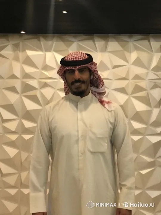 Man in Traditional Attire Smokes by Patterned Wall – AI Generated Video | Hailuo AI