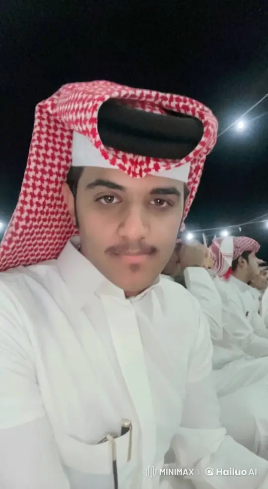 Man Smoking in Traditional Attire at Night Gathering – AI Generated Video | Hailuo AI