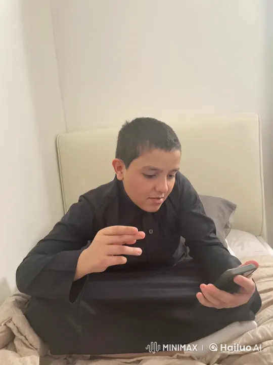 Young Person Mimics Smoking Gestures While Using Smartphone – AI Generated Video | Hailuo AI