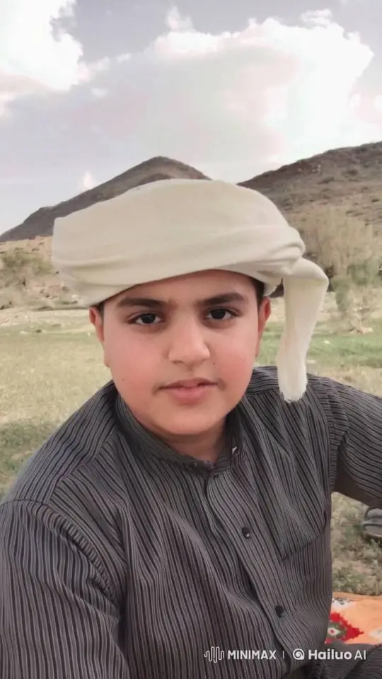 Young Boy Smoking Calmly in Mountainous Landscape – AI Generated Video | Hailuo AI