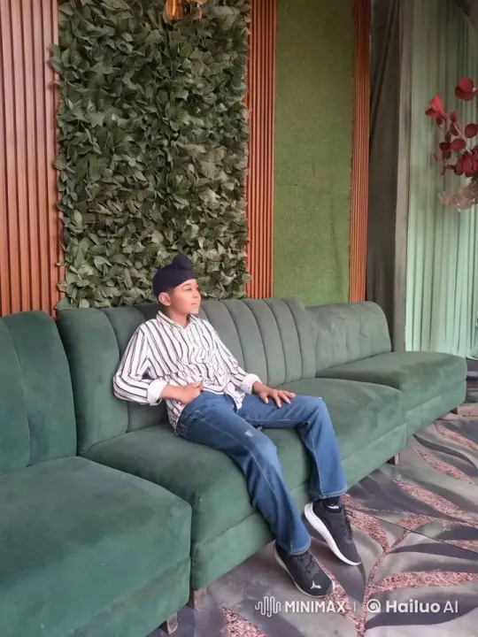 Boy Dancing Energetically on Green-Themed Couch – AI Generated Video | Hailuo AI