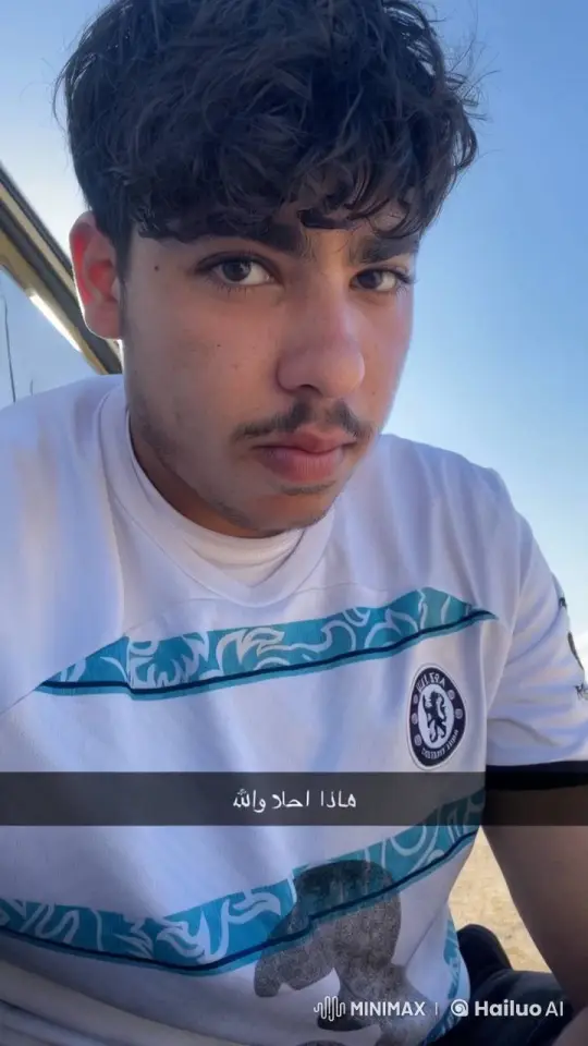 Young Man in Chelsea Shirt Smokes Thoughtfully – AI Generated Video | Hailuo AI